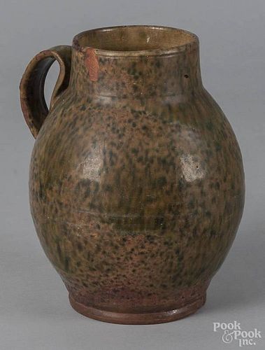 New England redware jug, 19th c., with speckled green glaze, 10'' h. Provenance: Steve Corrigan