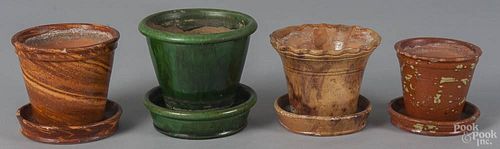 Four Pennsylvania redware flowerpots, 19th c., to include a green glaze example