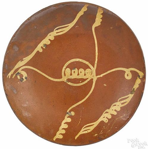Connecticut redware charger, 19th c., with yellow slip decoration, 14 1/2'' dia.