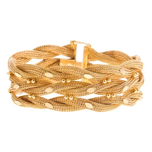 A Ladies Wide Braided Bracelet in 18K Gold