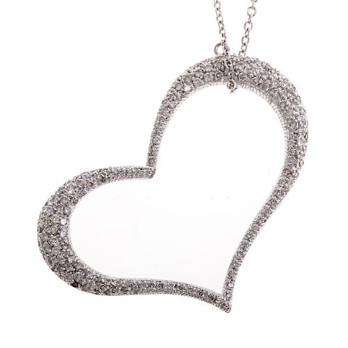 A Ladies Pave Diamond Heart Pendant in 14K