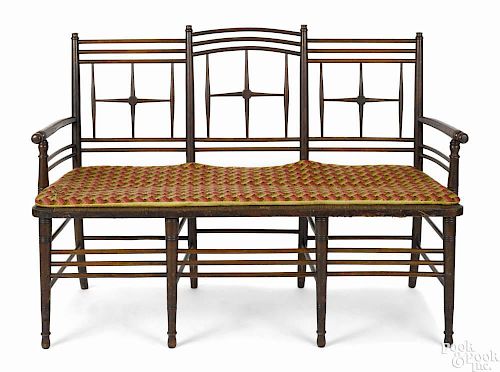 Sheraton rush seat settee, ca. 1840, with a spindle back and turned legs, 38 1/2'' h., 53'' w.