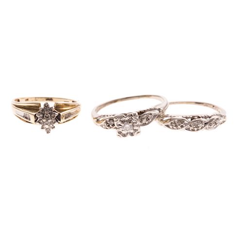 A Trio of Diamond Engagement Rings & Bands in Gold