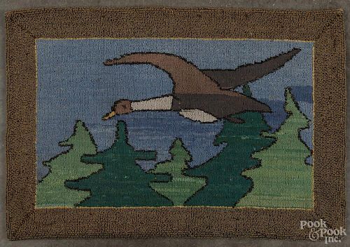 Grenfell hooked rug with a flying goose, 12 1/4'' x 18''. Provenance: Antiques Collaborative, 2001.
