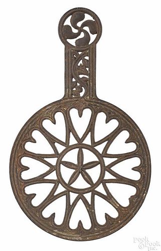 Maryland cast iron trivet, 19th c., stamped Baltimore on underside, 13'' l.