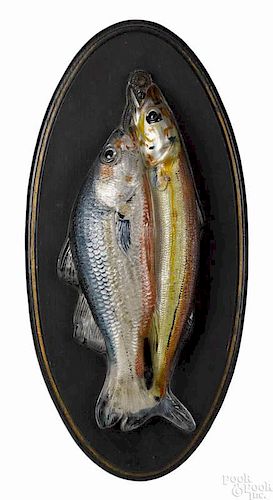 Pair of Atterbury & Company reverse painted fish plaques, ca. 1900