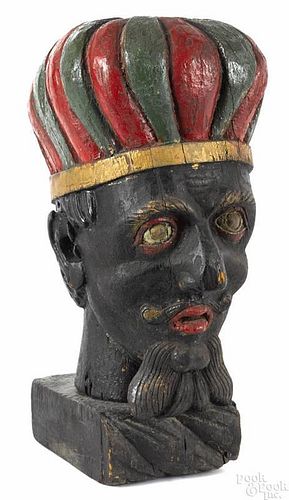 Carved and painted blackamoor head, 19th c., retaining an old polychrome surface, 22'' h.