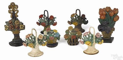Eight painted, cast iron figural flower doorstops, 20th c., to include four Hubley no. 120