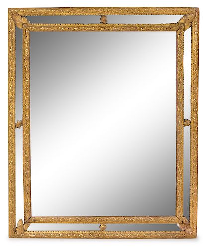 A Regence Style Giltwood Mirror Height 35 3/8 x width 29 inches.