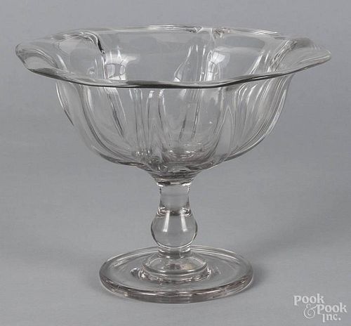 Colorless flint glass compote, mid 19th c., with a thick circular foot, a baluster stem