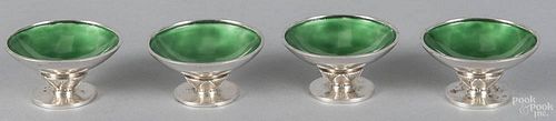 Set of four Georg Jensen sterling silver salts with a designer mark of Dessin and green enamel