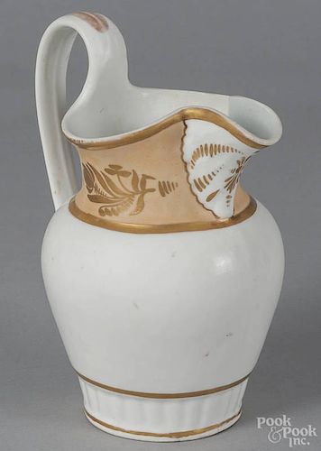 Philadelphia Tucker porcelain pitcher, ca. 1830, with a salmon banded rim and gilt highlights