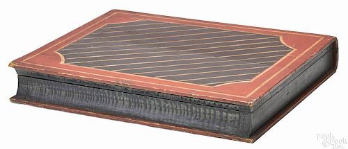 Carved and painted book-form box, 19th c., retaining its original polychrome surface and wallpaper