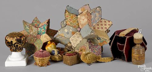 Assorted pincushions, 19th/20th c., to include a pincushion with a treen stand