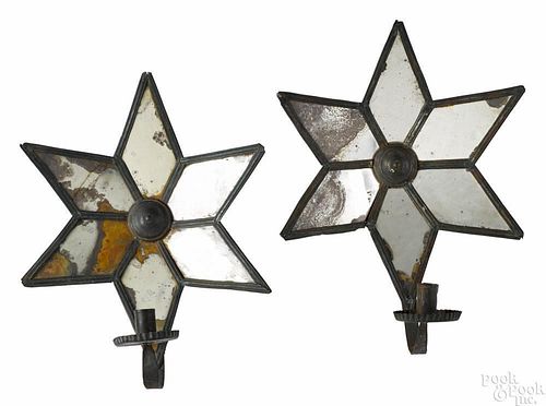 Pair of painted tin mirrored star candle sconces, 19th c., retaining an old green surface