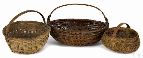 Three splint gathering baskets, 19th c., to include a buttocks basket, 4 1/2'' h.