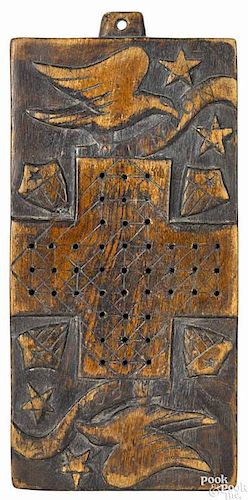 Civil War era carved walnut gameboard, 19th c., with relief carved eagles clutching banners