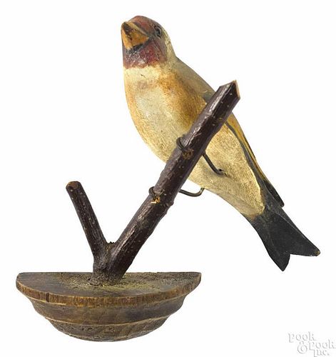 Carved and painted hanging songbird, with a pencil inscription Miller 1893 on base