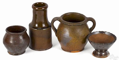 Four pieces of American redware, 19th c., to include a bottle, 5'' h., a double-handled crock