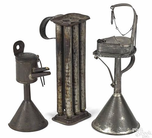 Group of tin lighting, 19th c., to include a fat lamp on a stand, 13 1/4'' h.