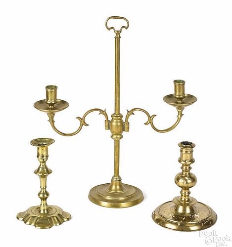 Dutch brass two-arm candelabrum, 18th c., 17 1/2'' h., together with a single Dutch brass candlestick