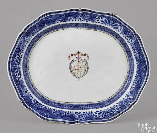 Chinese export porcelain platter, ca. 1800, with a blue butterfly border and a central shield with