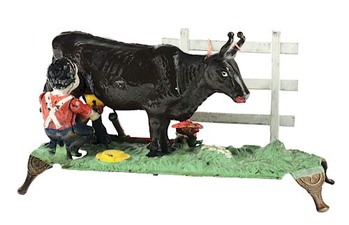 J. & E. Stevens Milking Cow Cast Iron Mechanical Bank.
