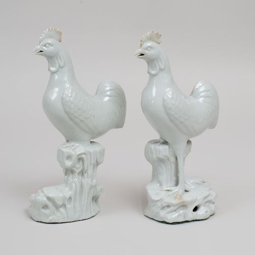 Pair of Chinese White Glazed Pottery Figures of Roosters on Rockwork
