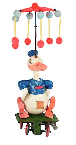 Pre-war Japanese Tin and Celluloid Wind Up Donald Duck Carousel. 