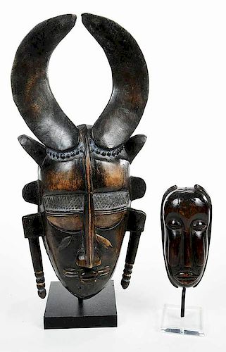 Two Carved Wood African Masks Mounted