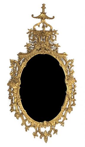 A Rococo Style Giltwood Mirror, Height 59 x width 31 inches.