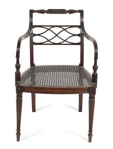 A Regency Style Mahogany Open Arm Chair, Height 32 1/2 x width 21 x depth 19 1/2 inches.