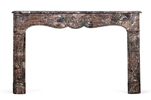 A Louis XV style carved marble fire surround
