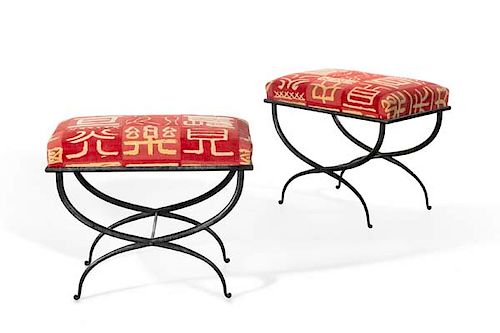 A pair of Pompeiian style wrought iron stools
