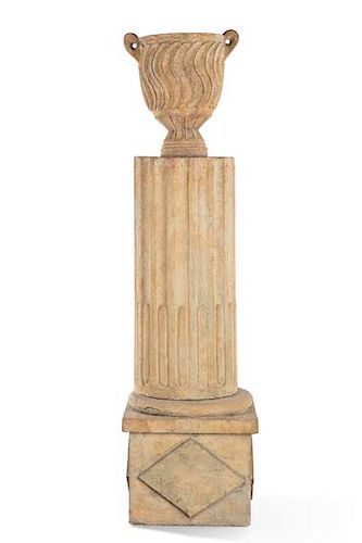 A Louis XVI style cast stone urn on fluted column