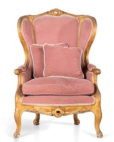 A Louis XV style carved giltwood bergere