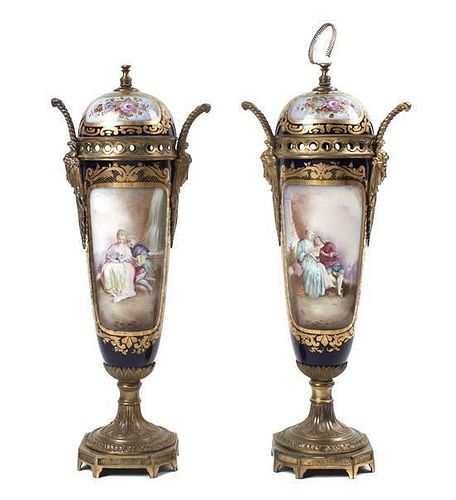 A Pair of Sevres Style Porcelain and Gilt Metal Mounted Covered Urns, Height 17 1/2 inches.