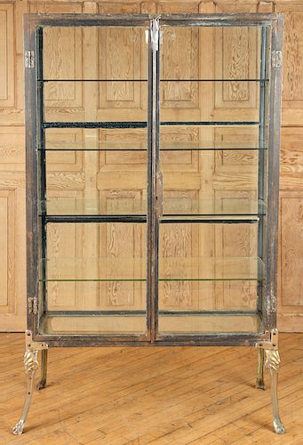 A TWO DOOR GLASS AND IRON VIRTINE CIRCA 1910