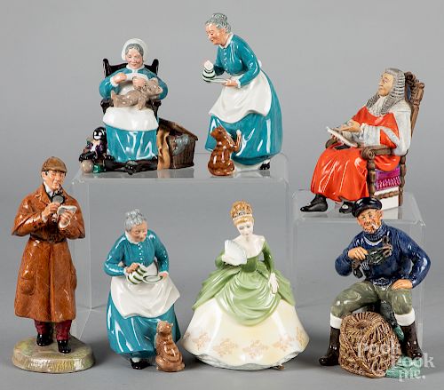Seven Royal Doulton figures.