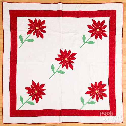 Appliqué quilt with red flowers