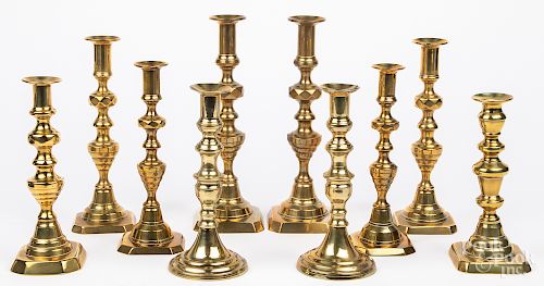 Five pairs of English Victorian brass candlesticks