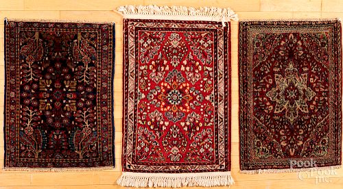 Three Sarouk mats.