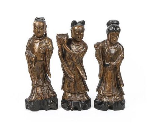 A Set of Three Chinese Carved and Painted Wood Figures of Immortals Height of tallest 12 inches.