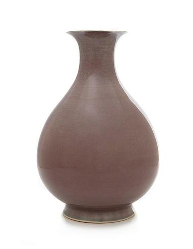 A Copper Red Glazed Porcelain Vase, Yuhuchun Ping Height 11 1/4 inches.