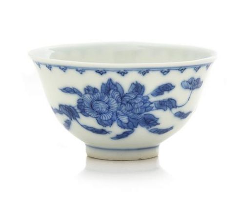 A Blue and White 'Peony' Porcelain Cup Height 1 7/8 inches.