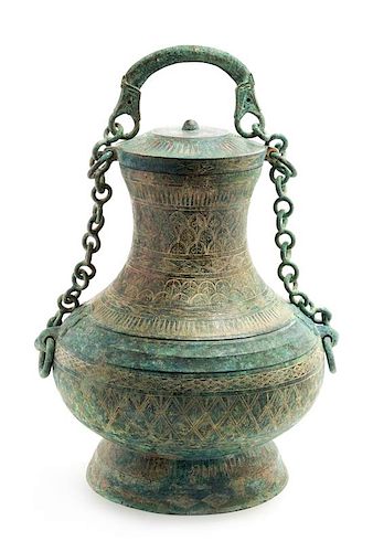 An Archaic Bronze Ritual Wine Vessel, Tilianghu Height 12 1/2 x width 9 1/2 inches.