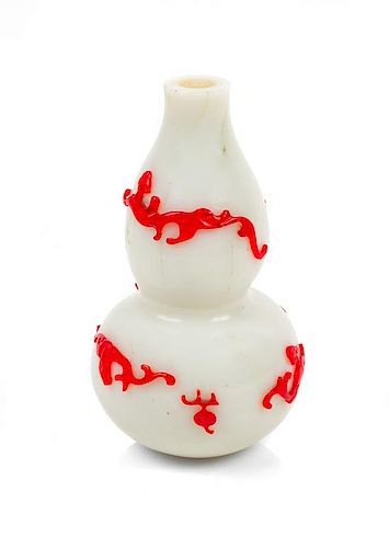 * A Red Overlay White Glass Gourd-Form Bottle Vase Height 5 3/4 inches.