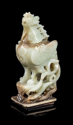 * A Russet and Celadon Jade Phoenix-Form Covered Vessel Height 8 1/2 inches.