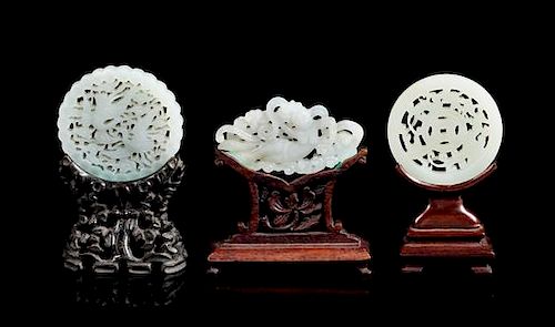 Three Pale Celadon Jade Reticulated Plaques Diameter of largest 2 3/8 inches.
