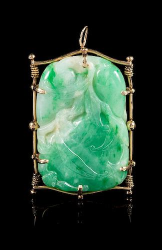 A Gold Mounted Jadeite 'Peach and Bat' Brooch Length 2 1/4 inches.